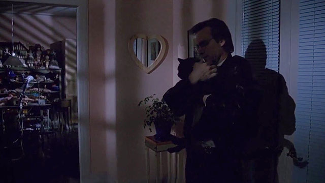 Scissors - black cat Midnight being carried by Alex Steve Railsback