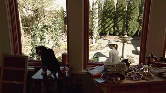 Secret Lives - tabby and white cat Cleo on table with Jill Daphne Zuniga outside