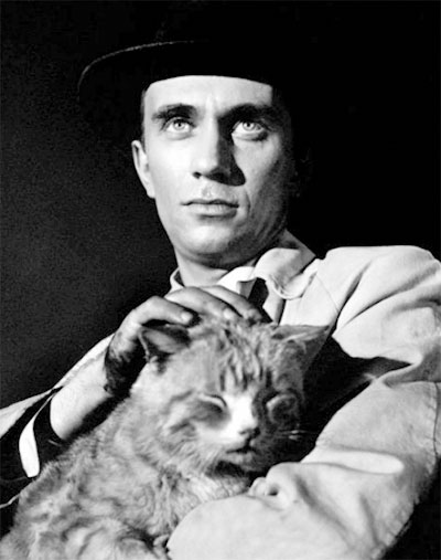 Short Cut to Hell - Kyle Robert Ivers holding dirty tabby cat Corky publicity still