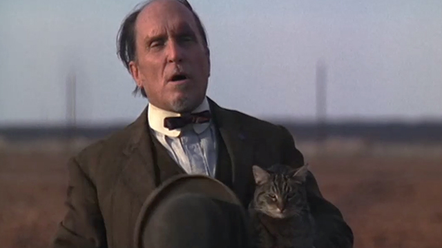 The Stars Fell on Henrietta - Mr. Cox Robert Duvall walking away with brown tabby cat Matilda