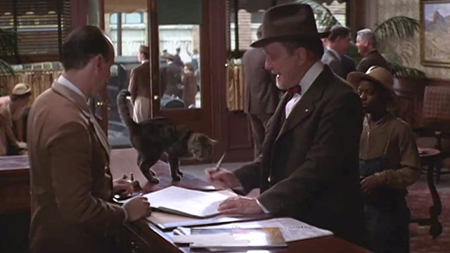 The Stars Fell on Henrietta - Mr. Cox Robert Duvall with brown tabby cat Matilda checking into hotel