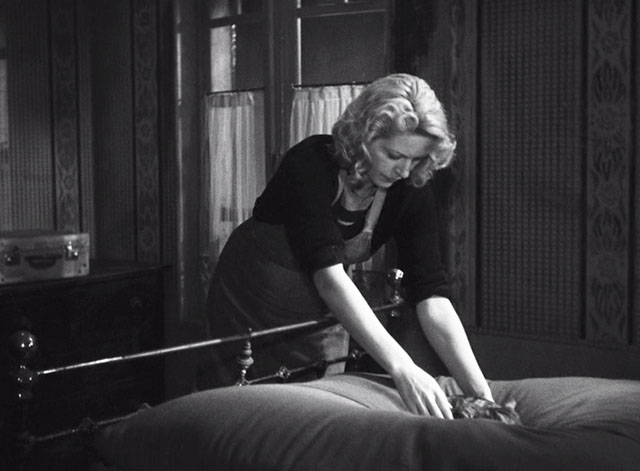 Such a Pretty Little Beach - Marthe Madeline Robinson reaching to pick up tabby cat from bed