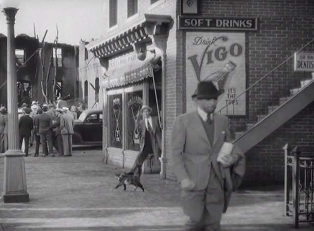 The Talk of the Town - Professor Lightcap Ronald Colman followed down street by Jan Pulaski Leonid Kinskey with tortoiseshell cat passing by