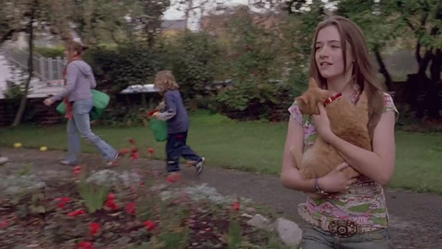 Tara Road - Annie Sarah Bolger holding ginger tabby cat Clemence with Ria Olivia Williams and Brian Johnny Brennan