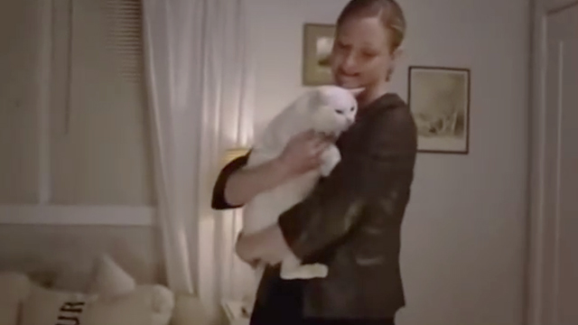 A Taste of Romance - Sara Westbrook Teri Polo hugging white cat Daisy