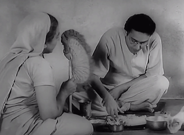 Three Daughters - Samapti - Amulya Soumitra Chatterjee eating with white kitten with markings and mother Gita Dey