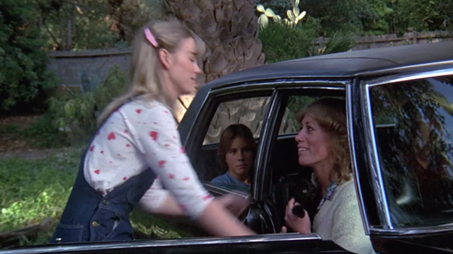 To All a Good Night - Nancy Jennifer Runyon with family member holding black kitten in car