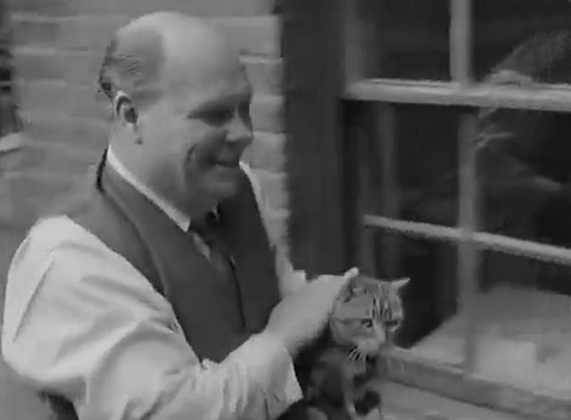 Tommy Gets Moving - Tommy Steele stepfather Mr. Hicks carrying tabby cat from backyard