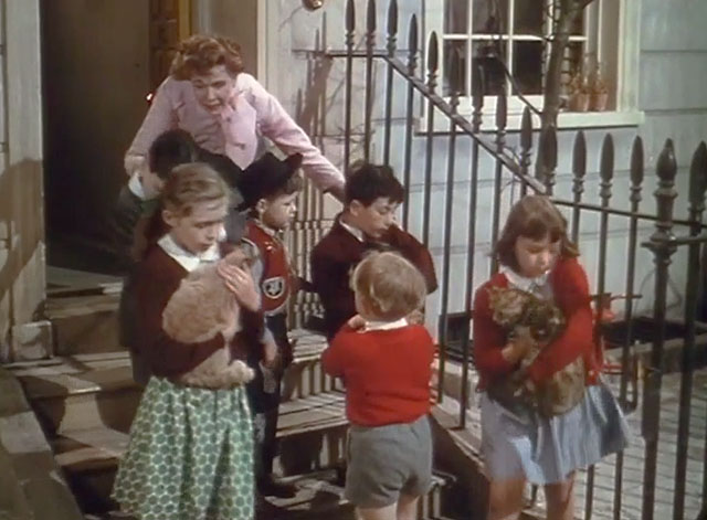 Touch and Go - Helen Margaret Johnson with numerous children holding cats on landing