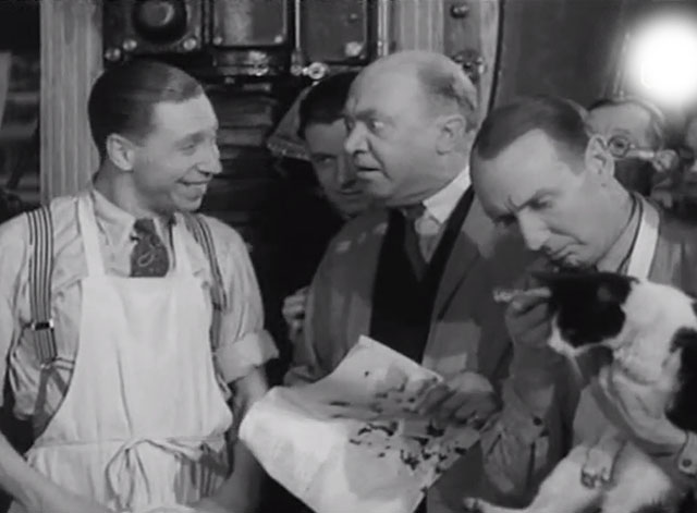 Trouble Brewing - George Formby with newspaper men and tuxedo cat