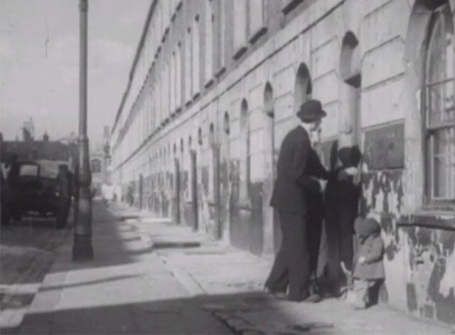 Vengeance is Mine - Charles Heywood Valentine Dyall and Stacy Sam Kydd walking down street toward child and preening tabby cat in doorway