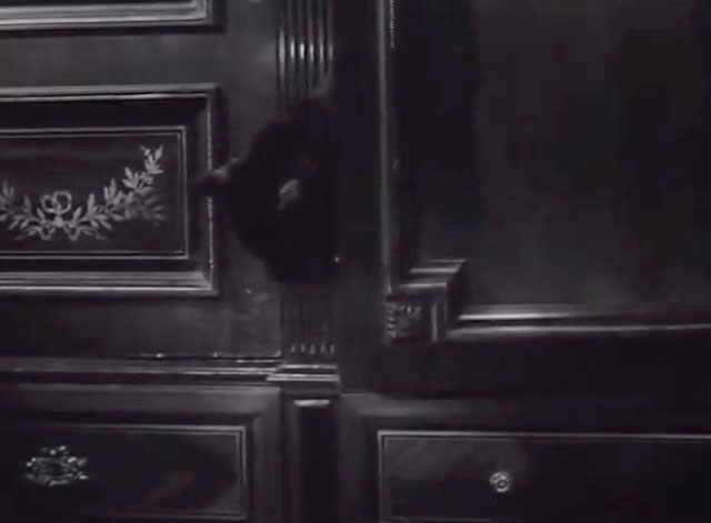 What a Carve Up! - black cat peeking into room from hidden panel