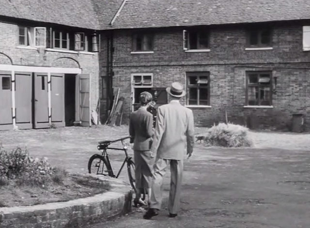 Your Witness - tabby cat emerging from behind hay pile behind Robert Montgomery, Patricia Wayne and John Sharp