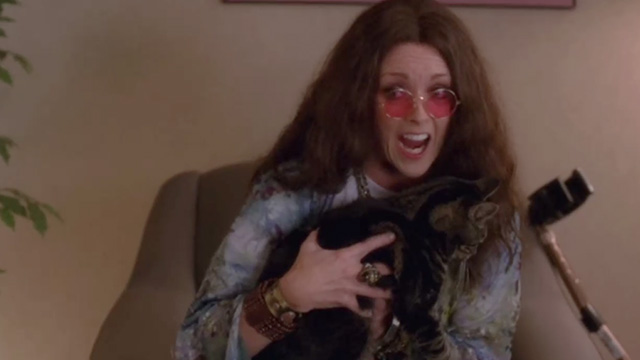 30 Rock - Retreat to Move Forward - Jenna Jane Krakowski dressed as Janis Joplin holding tabby cat