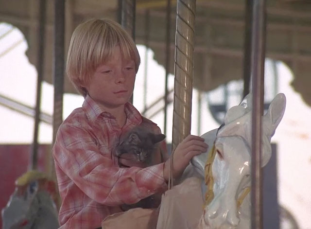 Charlie's Angels - To Kill an Angel - Skip Dennis Dimster holding grey tabby kitten on merry go round horse