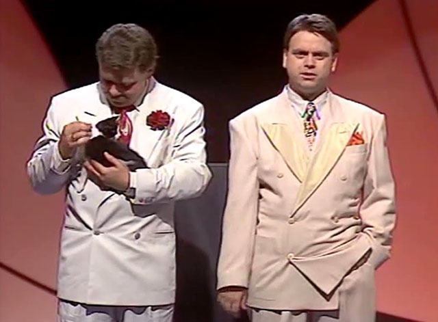 Hale & Pace - Season One, Episode One - Gareth Hale and Norman Pace on stage with tuxedo kitten