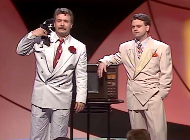 Hale & Pace - Season One, Episode One - Gareth Hale and Norman Pace on stage with tuxedo kitten and microwave oven