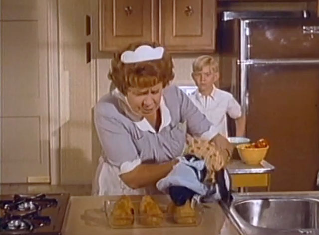 Hazel - Hazel's Endearing Young Charms - black cat eating salmon croquettes in front of Shirley Booth and Harold Bobby Buntrock