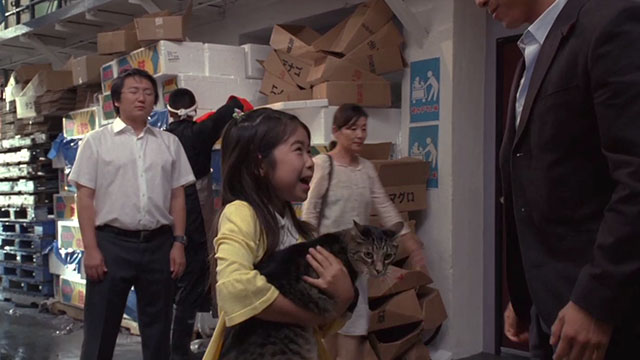 Heroes - Orientation - little girl Marine Fujisawa holding brown tabby cat Muffin Man with Hiro Masi Oka frozen in background