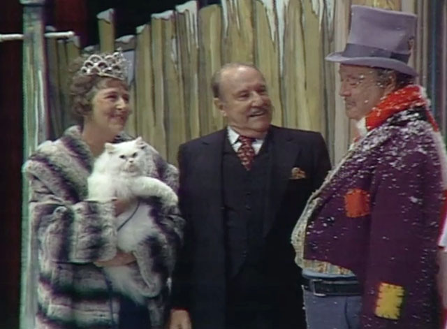 The Honeymooners Special A Christmas Carol - Mrs. Marshall Templeton Fox holding white Persian cat Millicent with Mr. Marshall Gale Gordon and Ralph Kramden Jackie Gleason