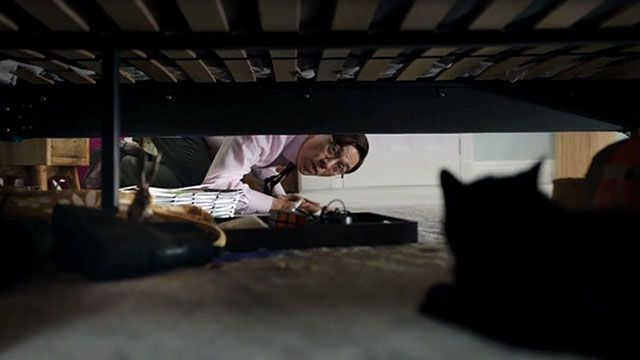 Inside No. 9 - Paraskevidekatriaphobia - Gareth Reece Shearsmith looking at black cat under bed