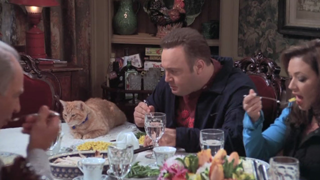 The King of Queens - Inn Escapable - Doug Kevin James at dinner eyeing orange tabby cat Marmalade on table