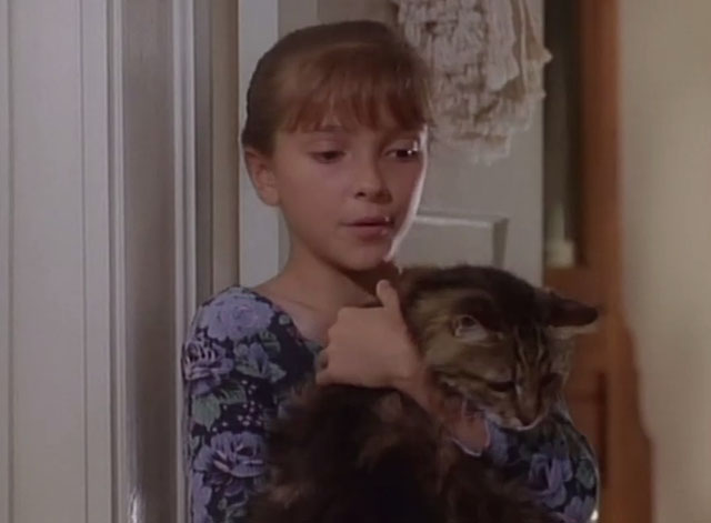 Matlock - The Verdict - Molly Amanda Minikus holding longhair brown tabby cat Misty in doorway