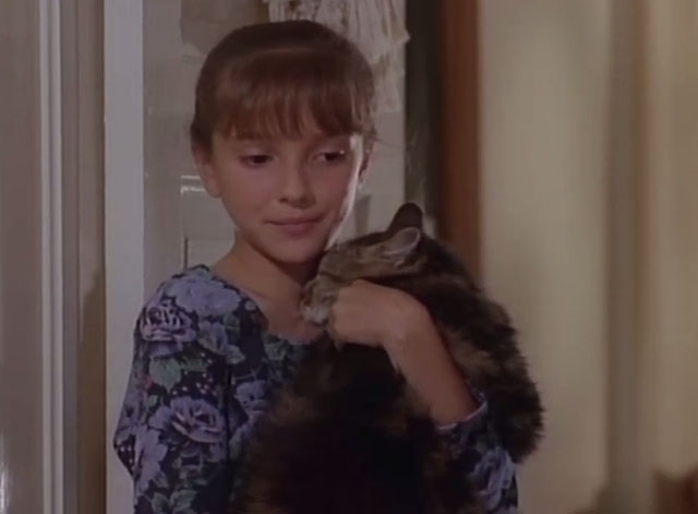 Matlock - The Verdict - Molly Amanda Minikus holding longhair brown tabby cat Misty in doorway