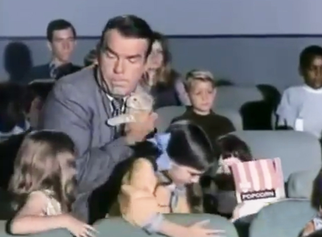 My Three Sons - The Littlest Rebel - Steve Fred MacMurray holding tiny ginger tabby kitten in movie theater with Dodie Dawn Lyn