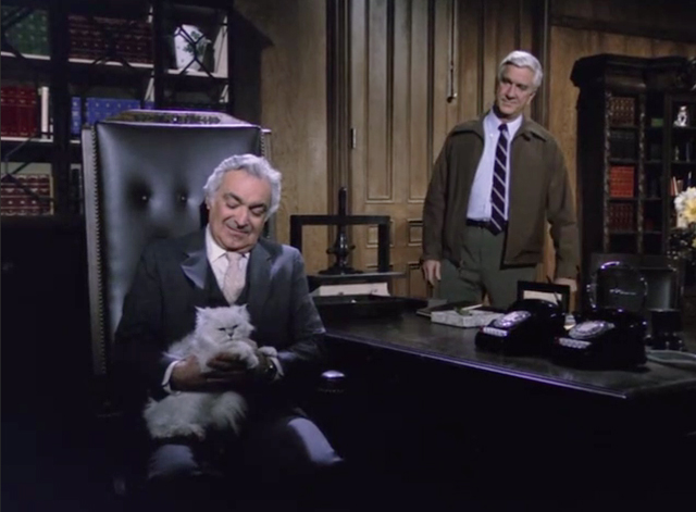 Police Squad! - Rendezvous at Big Gulch - Frank Drebin Leslie Nielsen with Dutch Al Ruscio at desk with white longhair Persian cat on lap