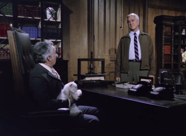 Police Squad! - Rendezvous at Big Gulch - Frank Drebin Leslie Nielsen with Dutch Al Ruscio at desk with white longhair Persian cat on lap