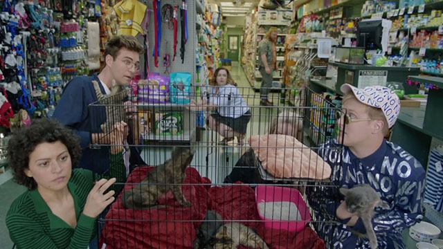 Search Party - Frenzy - Dory Alia Shawkat, Drew John Reynolds, Elliott John Early and Portia Meredith Hagner and Kennifer Diedre Friel ducking down with young kittens in pet shop